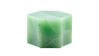 A translucent, hexagonal block of jade-like material against a stark black background
