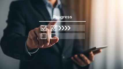 Businessman interacting with a progress bar on a transparent screen with a smartphone in hand in a modern office setting with blurred background