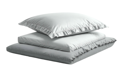 Stack of three soft, white bed linens, pillow and coverlet, with decorative edges
