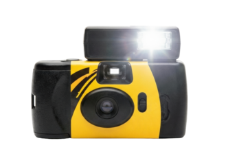 Disposable film camera with bright flash. Retro photography equipment.