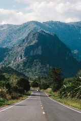 Naklejka premium Open Road Journey Through Mountain Landscape