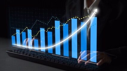 A business professional utilizes a laptop to analyze financial data, featuring digital graphs and charts that depict growth trends, enhancing decision-making processes. Copula