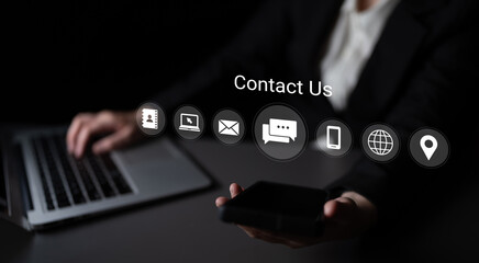A modern business scene showcasing a professional using a laptop and smartphone, with contact icons prominently displayed, emphasizing communication and support services. Gantry