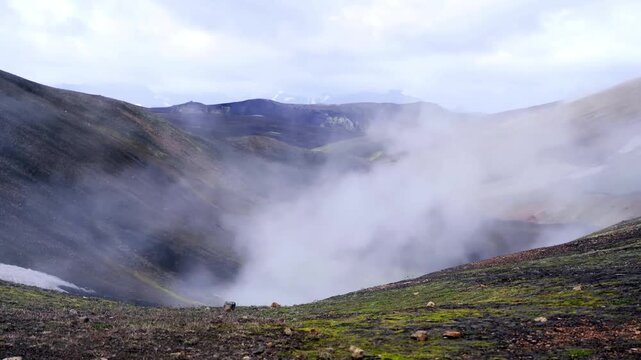 Moody Atmospheric View of Mst Shrouding Volcanic Mounains