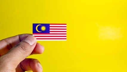 A Malaysian flag magnet shown in a simple composition, symbolizing unity, identity, and patriotism.