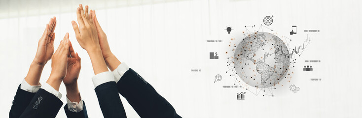 Hands of professionals reaching upward symbolize teamwork and collaboration in a modern business setting, highlighting global connectivity and shared success. Trope