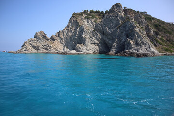 Fototapeta premium Crystal Clear Waters near Rocky Coastline, Capo Vaticano, Italy