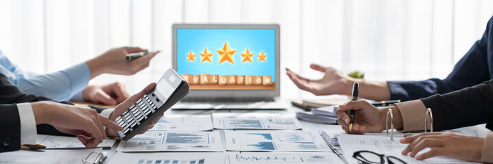 Business intelligence and data analysis concept. Analyst team working on financial data analysis dashboard on laptop screen as marketing indication for effective business strategic planning. Insight