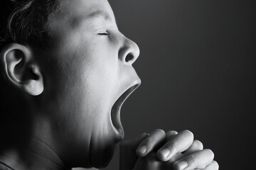 little boy praying to God with hands together with people stock image stock photo 