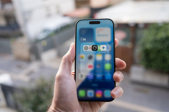 Kyiv, Ukraine - January 1, 2026: The Grock Gemini and ChatGPT logos on a smartphone screen
