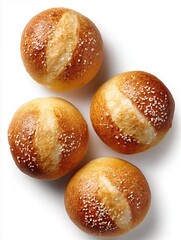 Freshly baked Kaiser rolls with sesame seeds, isolated on a white background
