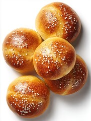 Freshly baked Kaiser rolls with sesame seeds, isolated on a white background
