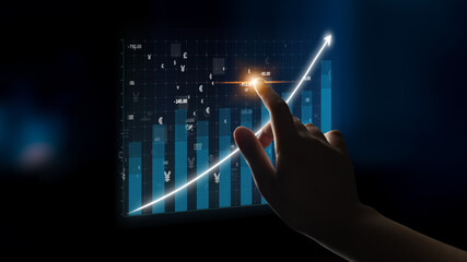 A hand reaches out to touch a digital screen showcasing a financial graph with rising data, symbolizing growth, investment, and advanced analytics in technology. Impute