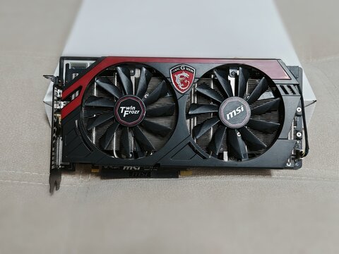 Belarus, Minsk, December 31, 2025. MSI Gaming Graphics Card with Twin Frozr Cooling. Close-up view of dual-fan gaming graphics card featuring red dragon logo and cooling system.