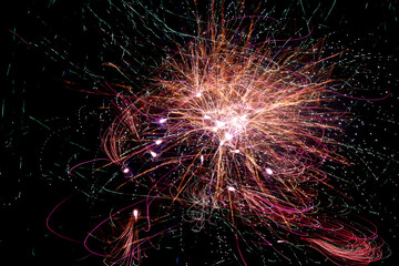 Abstract Firework Light Trails With Bright Bursts on Black Background