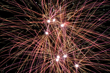 Abstract Firework Light Trails With Bright Bursts on Black Background