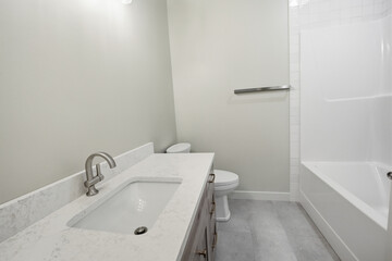 Bathroom with a white sink and toilet