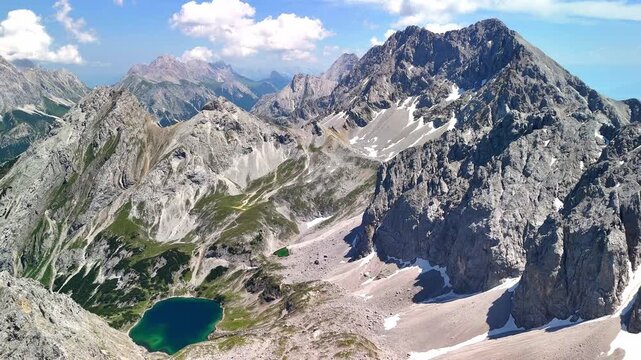 Aerial drone view of the Alps and the green Drachensee and Seebensee on a sunny summer day.