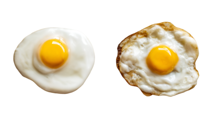 Two fried eggs with bright yellow yolks isolated on transparent background.