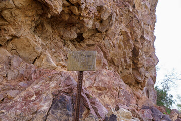 Sign - Travel at your own risk beyond this point at Wind Cave Trail at Usery Mountain Park Tonto National Forest Arizona