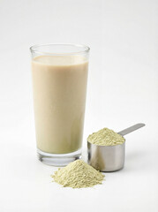 Green Protein Shake and Powder on White Background