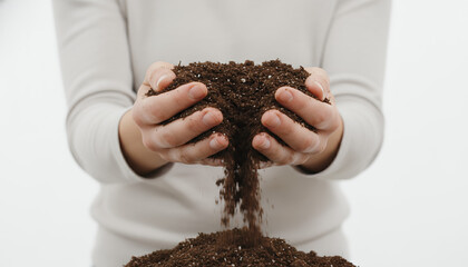 Hands Holding and Pouring Rich Potting Soil. Close-up of Gardener Preparing Earth for Planting, Growth, and Sustainable Agriculture on a White Background.