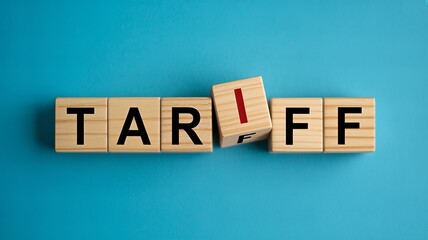 Wooden blocks spelling out tariff with one block askew