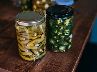 Jars of Pickled Green Peppers and Sliced Jalapenos