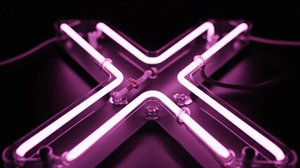 A vibrant closeup shot of a glowing pink neon light sign forming the letter X against a dark mysterious background creating a modern and energetic visual effect perfect for urban themes and digital c.