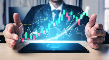 A businessman showcases digital financial graphs on a tablet, symbolizing growth and investment trends in a modern office, reflecting technological advancements. Impute
