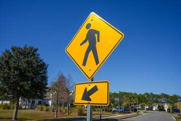 Bright Yellow Crosswalk Sigh Shot Against a Brilliant Blue Sky