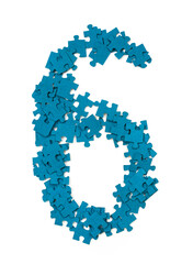 Blue puzzle pieces are arranged to form the number six on a white background. The pieces are disconnected, showing the playful nature of puzzles and learning.