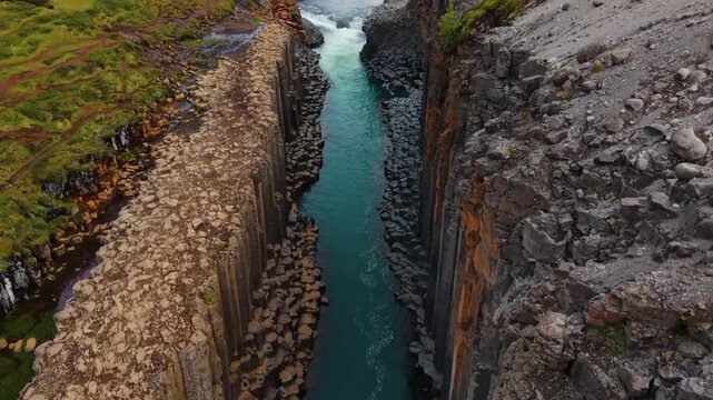 Top-Down Aerial View of Studlagil Canyon Basalt Colums and River