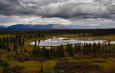 Sun shining on mountains on the Denali Highway
