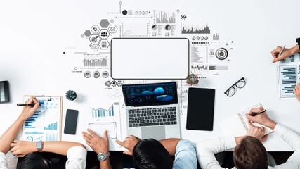 A modern workspace featuring charts, graphs, and various technology devices designed for data analysis and team collaboration in a business environment. Raster - Powered by Adobe