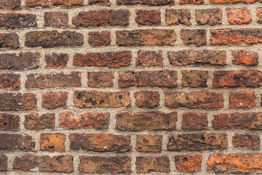 Full frame view of historic red and brown brick wall surface