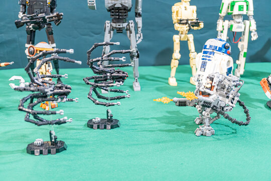 Lego diorama featuring Star Wars characters on a blue base, including C3PO, R2-D2, BB-8, and Ewoks Characters are meticulously arranged in a dynamic composition wit - Kyiv, Ukraine - June 8, 2025