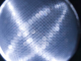 Abstract background in space theme with blurred white bokeh highlights. Modern design.