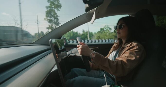Smart woman drive EV car with navigator dashboard Transport technology