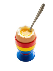 Soft boiled egg in colorful egg cup with spoon