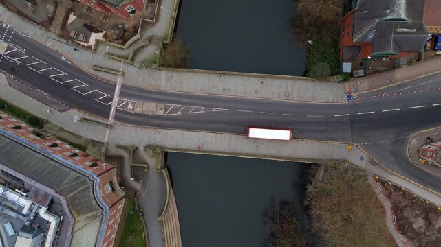 Top down aerial view of Exeter bridge in central Derby, pedestrians walking and birds flying, UK
