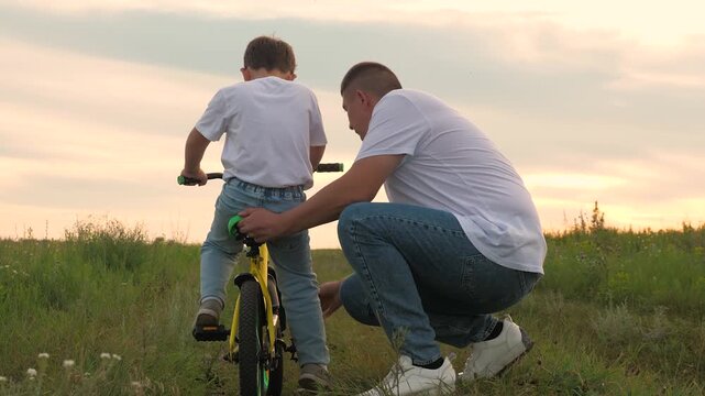 childhood grass, child kid little son man fix broken bicycle, smile boy face, fun game nature, father with son green park outdoors, adrenaline fast cycling, father running after bike child green