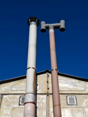 Exhaust or ventilation pipes in garage for a car