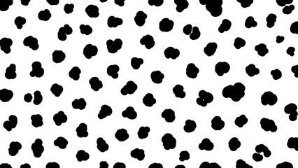 Fototapeta premium Abstract black spots scattered randomly on a bright white background, creating a pattern.