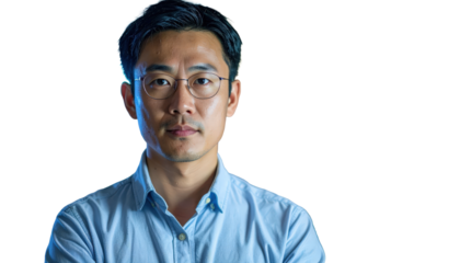 Portrait Of Asian Man Wearing Glasses And Blue Shirt Isolated On Transparent Background Looking At Camera For Business And Professional