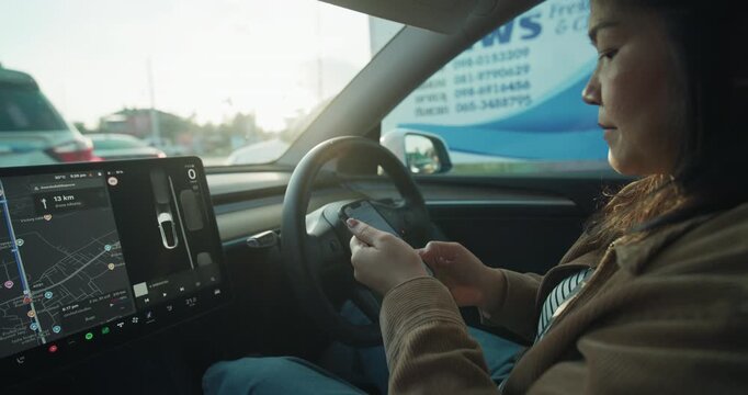 Business asian woman use GPS navigator EV car tracking transport technology slow motion