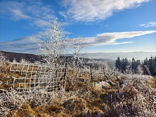 winter mountain landscape with fence