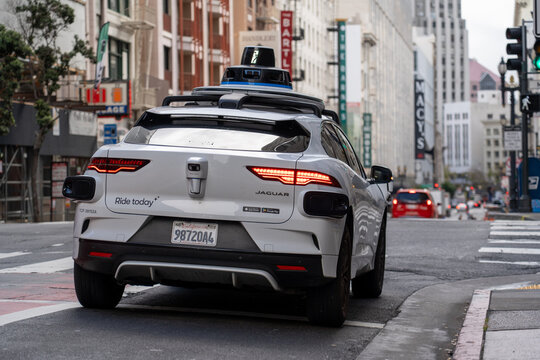 San Francisco, USA - September 10, 2025: A Waymo autonomous Jaguar vehicle drives through San Francisco, showcasing innovation in self-driving technology and the future of robo-taxis in urban mobility