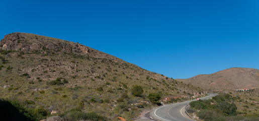 A road with a red sign on it