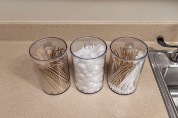 Above view of containers of cotton balls,tongue depressors and cotton applicators at a medical office